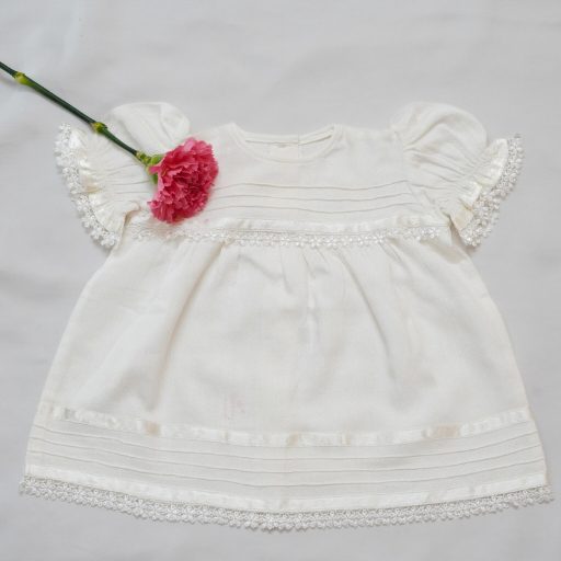 Frocks In White Self Woven fabric With Pintucks,Delicate Laces &ribbons alternate